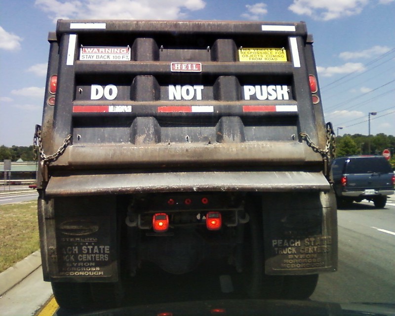 Why do dump trucks say "do not push" on the back? - Wisdom Biscuits